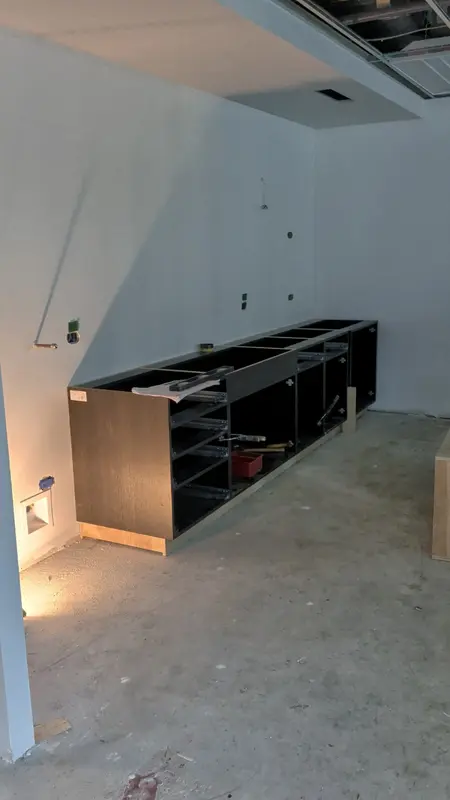 Base cabinet installation in progress