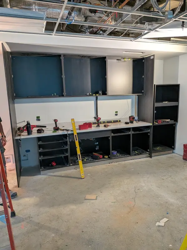 Wall cabinet installation in progress