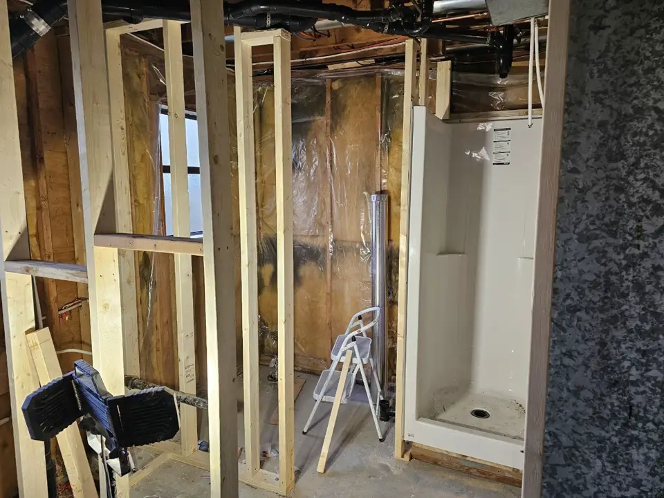 Bathroom framing and shower installation in progress